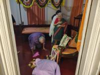 Sadhakas offer pranams in the Samadhi room